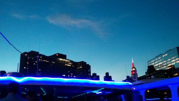 Top of the deck. The lonely Empire State lighting up.