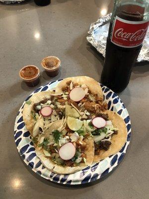 Chicken and carne asada tacos with a coke