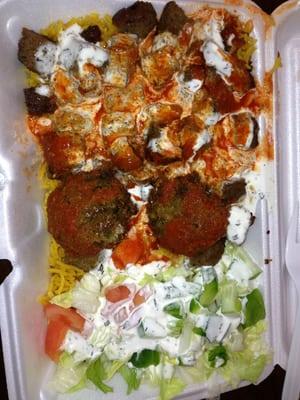 Lamb over rice with extra hot sauce and falafel!