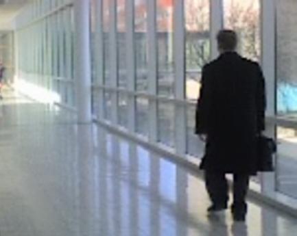 one of their long beautiful hallways with clear windows on left and right instead of white walls