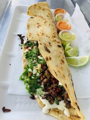 Machete with Campechanos (beef, chorizo, cheese, onions and cilantro) $10