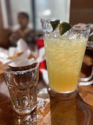 A pitcher of margarita on the rocks