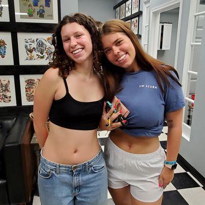 Friends with Belly naval piercings