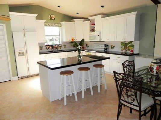 Tropical themed fruit and floral kitchen backsplash mural