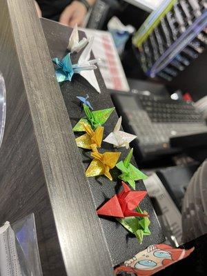 One of their customers folded paper cranes for them and they now live by the cash registers. So sweet!