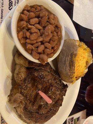 10 oz ribeye with pinto beans and baked potato.