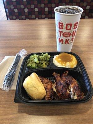 Three piece dark rotisserie chicken with a drink.