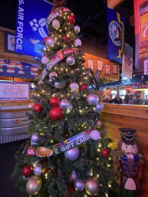 Christmas tree inside decor and military flags