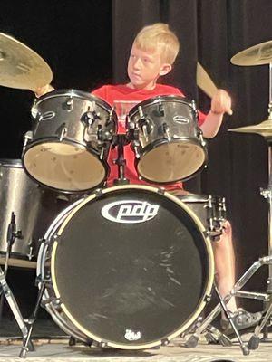 Isaac performing drum solo at KAA Spring Recital 2023