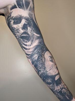 Daniel E. (the decaying face with ribs on the upper left arm) and Roby Latos (bottom of left arm)