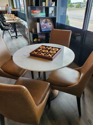 Cute table with giant tic tac toe game in the middle