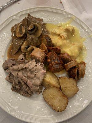 Potatoes, chicken franchise, roast beef, sausage, and mushroom meat and gravy.