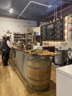 The board behind the register has tea specials!