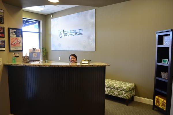 Treatment Coordinator Lisa peaking out from behind the counter!