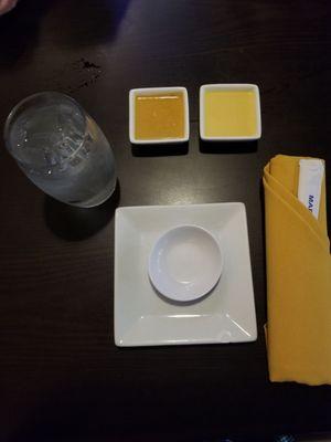 My place setting with mustard sauce and ginger dressing.