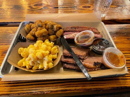 The one meat plate with two ribs added. Probably looks better than it tasted. sauce: sweet, heat, and Carolina. None of them remarkable.