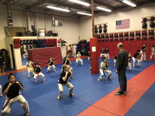 Instructor Mike preparing class for their belt test