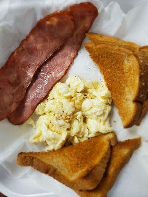 Light menu, we carry Canadian bacon, here we have it with scramble egg whites and whole wheat toast. A cup of fruit goes well with it.