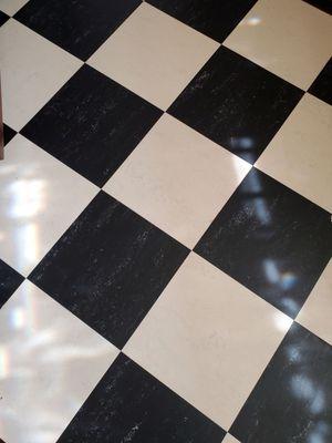 "White Marble" and "Black" Forbo Marmoleum 13" square tiles.