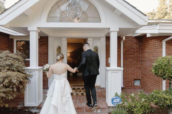 Me and my now husband entering our reception