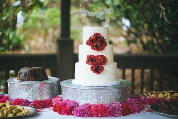 Some of the garlands from the ceremony altar were reused for table decor.  Photo by Rad & In Love