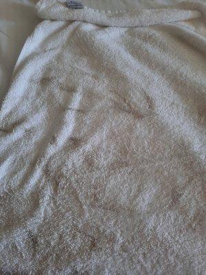 Dirt from the floor on  white towel