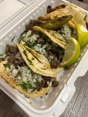 Two steak , two Al pastor tacos