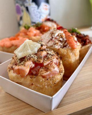 Front: Lemon pepper salmon, myungran crab, grilled spicy pork Back: creamy myungran, fresh salmon, spicy tuna