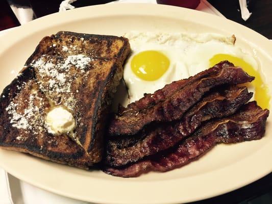 French toast, sunny side eggs, and beef bacon