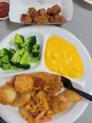 Cat fish, shrimp dinner with broccoli, hushpuppies & added fried clams.