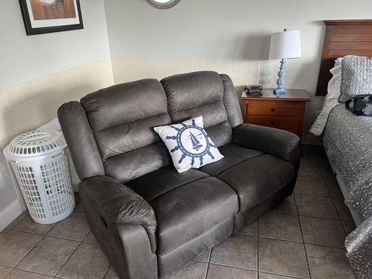 Sofa and jacuzzi tub behind it