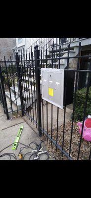 Installed mailbox into iron fence.