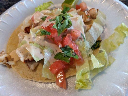 Shark taco, a bit dry. Not sure why the toppings are so chunky.  Needs an improvement.