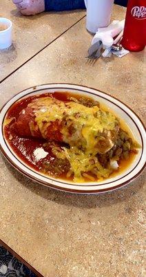 Smothered Red and Green Chile "Christmas" breakfast burrito with sausage, chicaron, papas, eggs and tons of cheese.