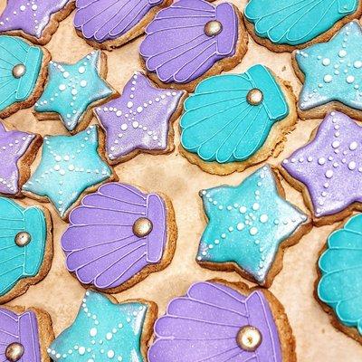 Shortbread cookies for "Under the Sea" theme. Iridescent white frosting touches and iridescent gold dots too. Beautiful and tasty.