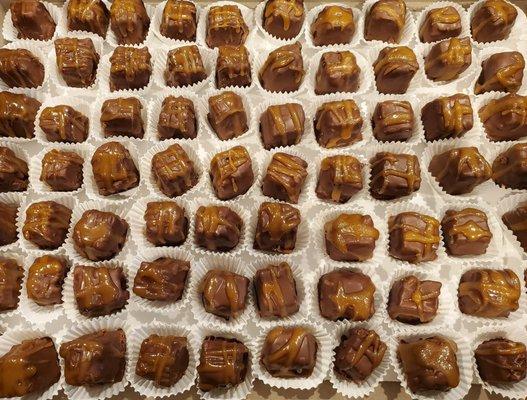 Salted Caramel on pretzel/brown sugar crust cheesecake bites dipped in semi-sweet chocolate