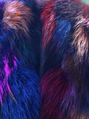 Only one left... the fur is multicolored attached to a sweater cape... which is reversible black or grey... fun and fabulous fashion!