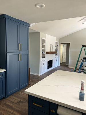 Open floor plan with kitchen and fireplace remodel