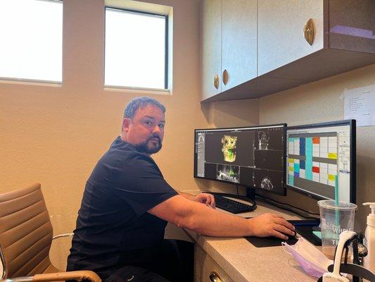 Dr. Carl Fairchild analyzing a patient's x-rays!