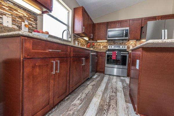 Burgandy Shaker Cabients installed by Sanford Granite.