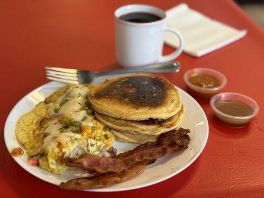 Mama Gina's omelette, sweet potato pancakes with homemade syrup, and crispy bacon