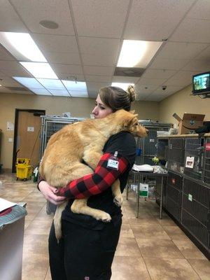 Chelsea holding a nervous puppy!