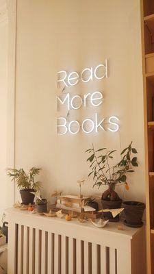 Inside Transom, a quaint display of origami and their "read more books" neon sign