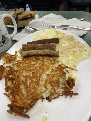 Over medium egg, link sausage, hashbrowns