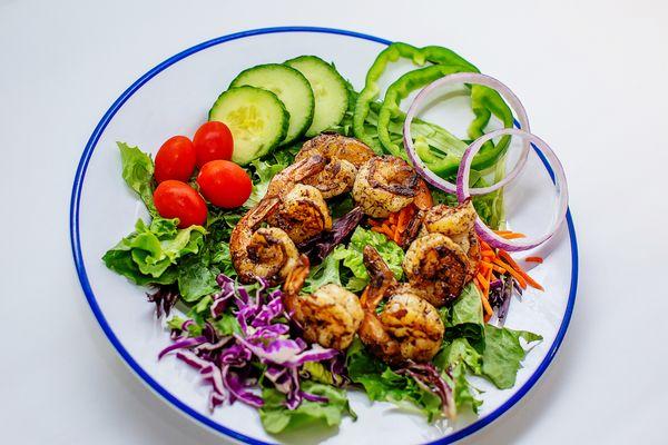 Salad topped with Shrimp