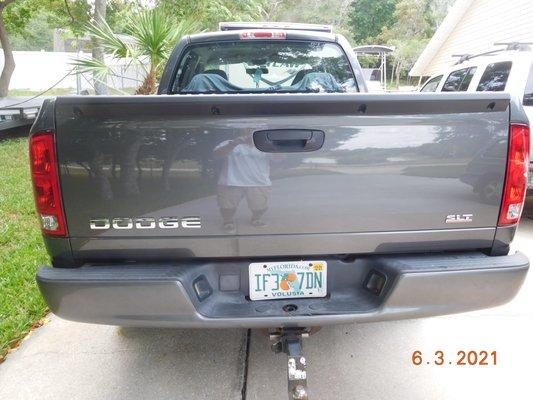 Repaired and painted tailgate with new emblems.