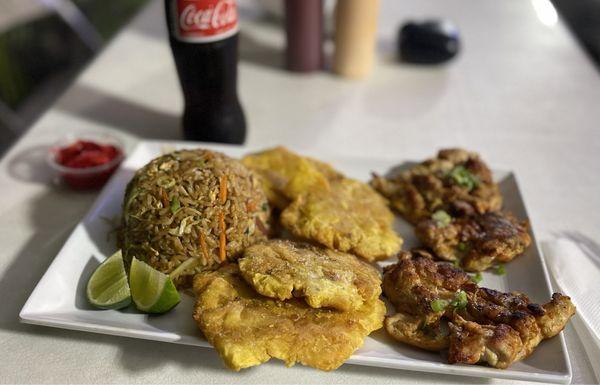 Asian fried rice with grilled chicken and tostones