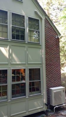 Blending in well with the exterior of the home.  Notice the "Slim Duct" running up to the attic.