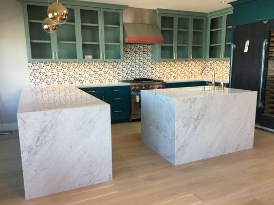 Slab Counter Top with Waterfalls. Tile Backsplash with Special Pattern