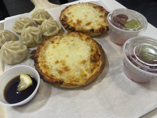 Chicken and vegetable dumpling , pizza , fruit cups